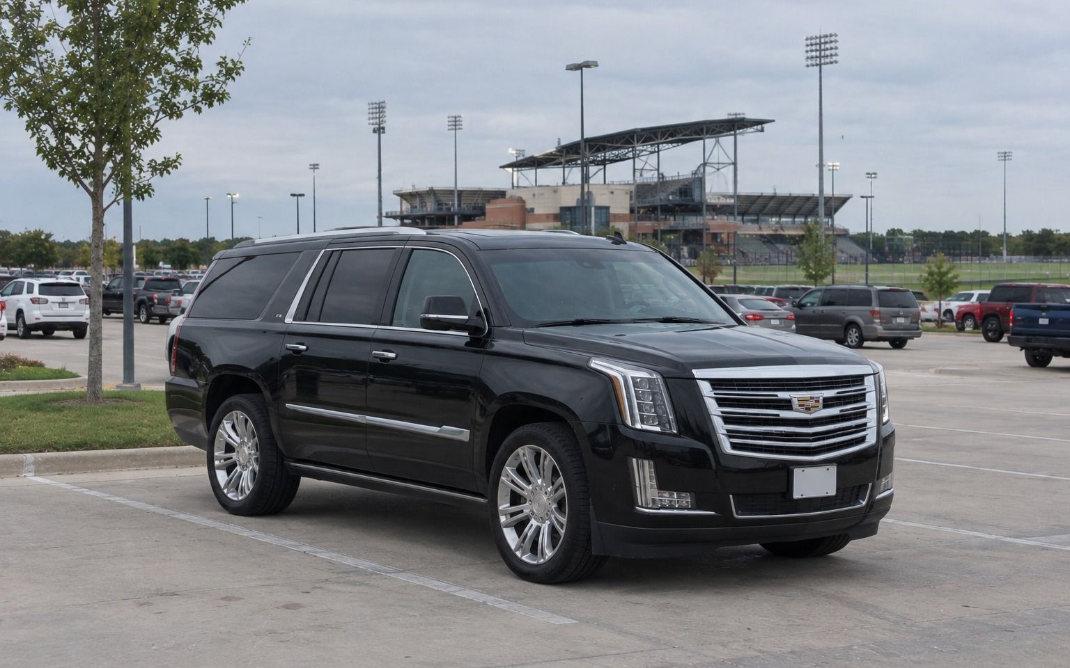 Black Cadillac Escalade parked in a lot near Toyota Stadium in Frisco
